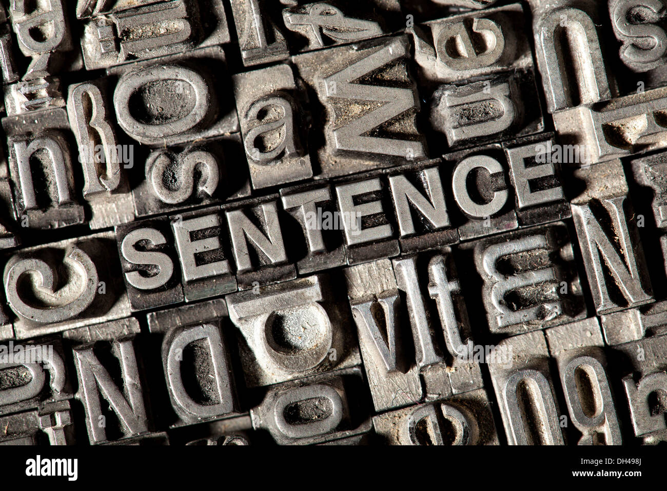 Old lead letters forming the word SENTENCE Stock Photo