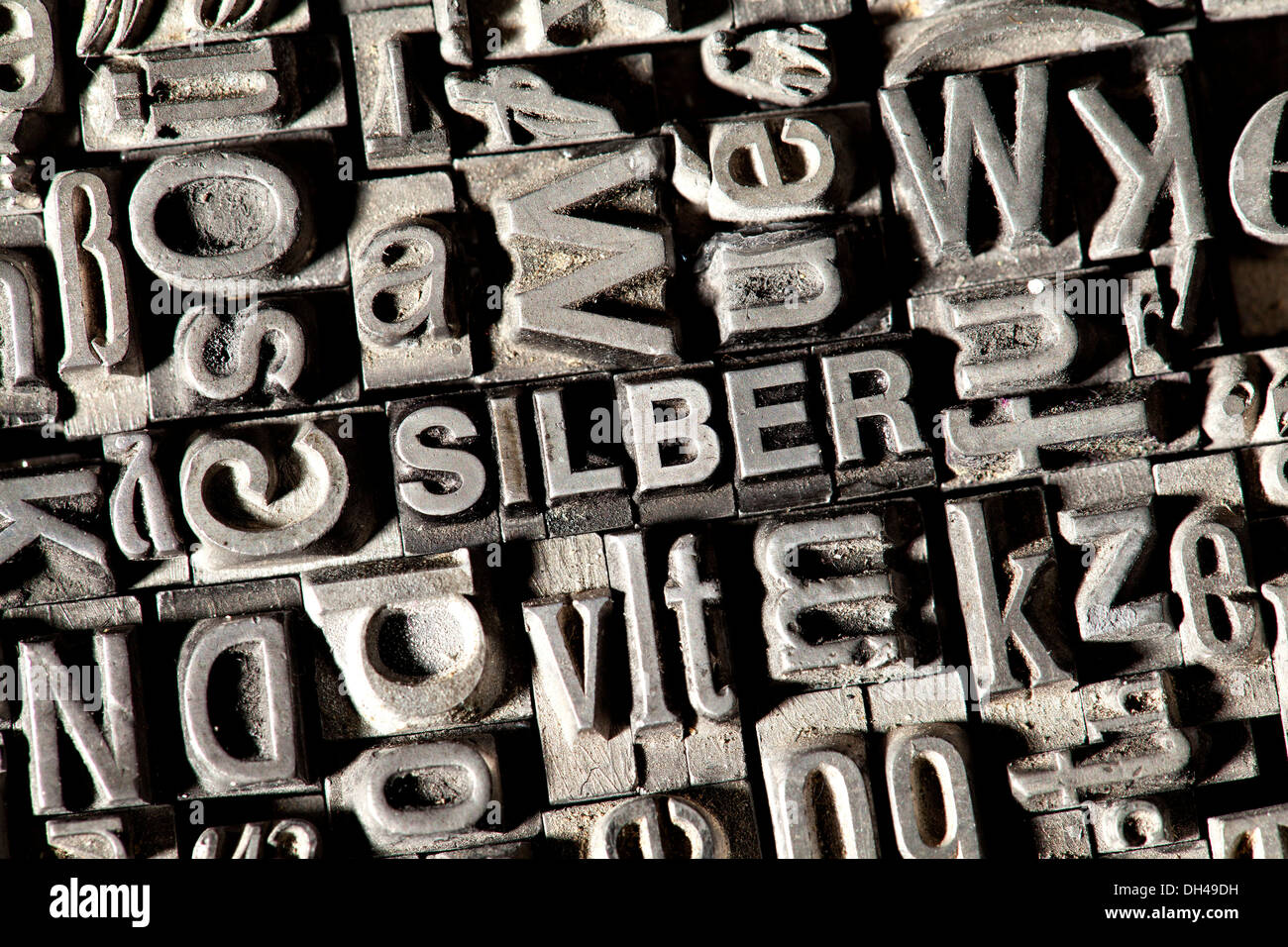 Old lead letters forming the word SILBER, German for silver Stock Photo