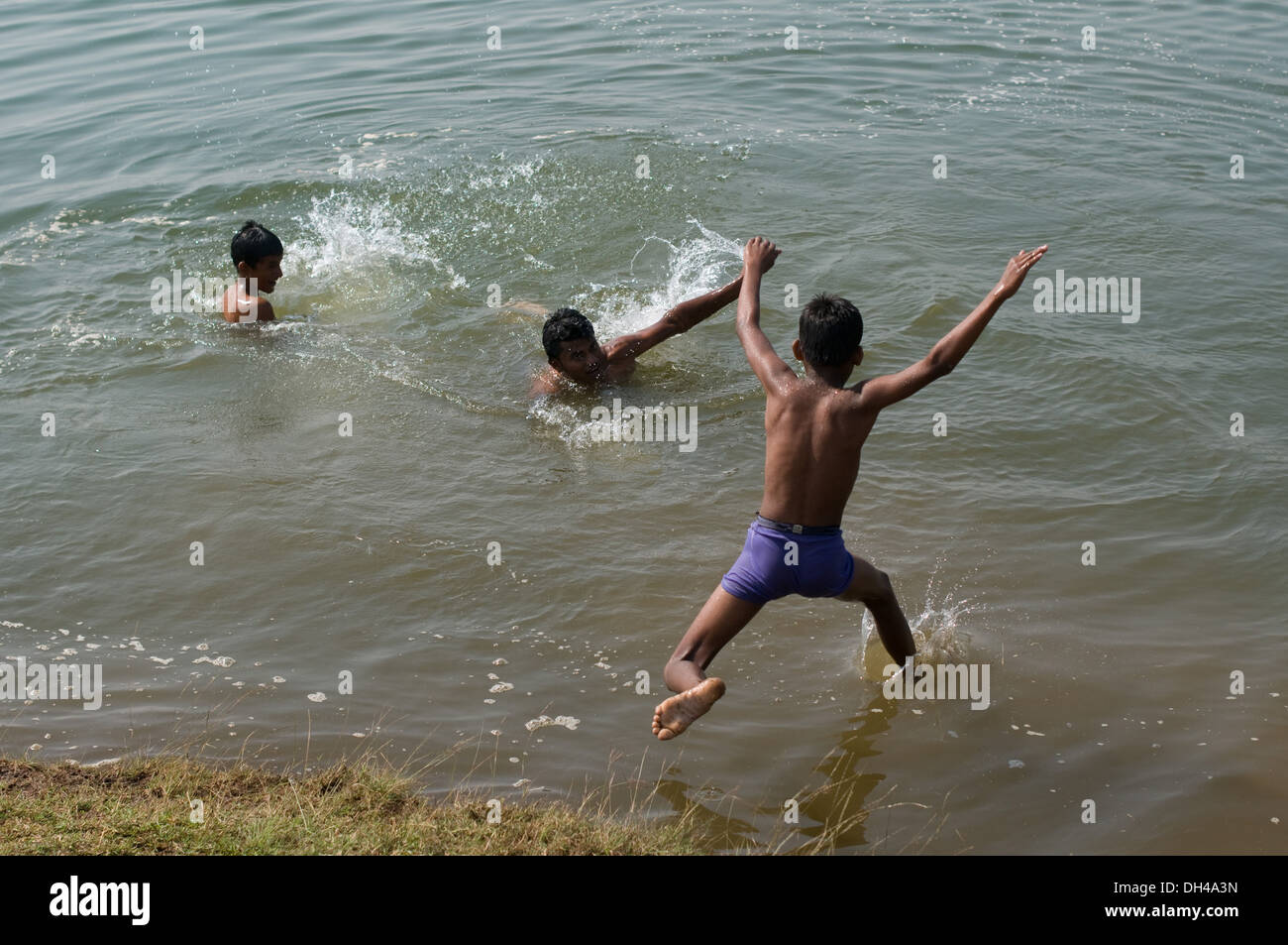 Indonisaian  boy river swim alamy Alamy