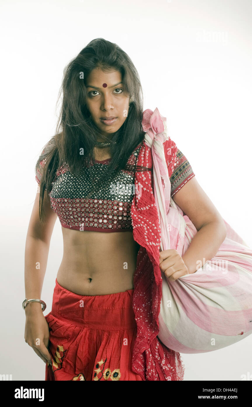 Girl wearing traditional dress and carrying bag Pune Maharashtra India Asia MR#686Z June 2012 Stock Photo