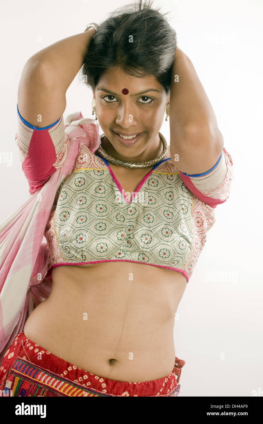 Girl tying hair Pune Maharashtra India Asia MR#686Z June 2012 Stock Photo
