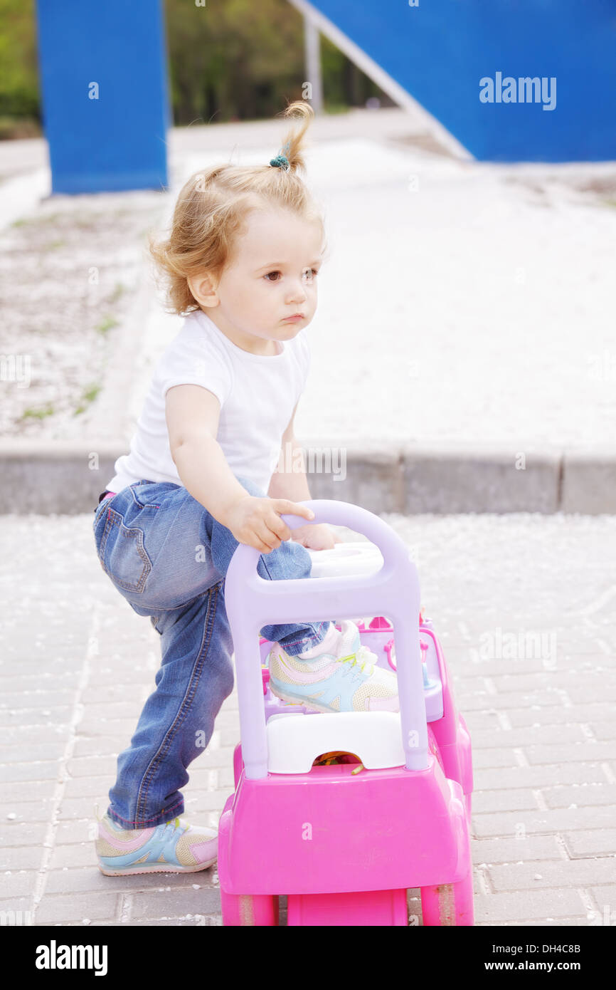 Little girl with toy car Stock Photo - Alamy
