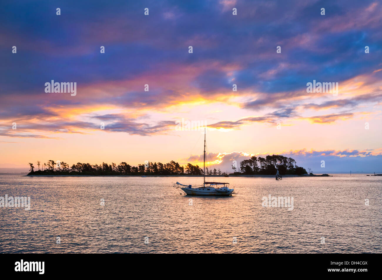 The city of Nelson, New Zealand. View from the coastline over the sea at sunset. Stock Photo