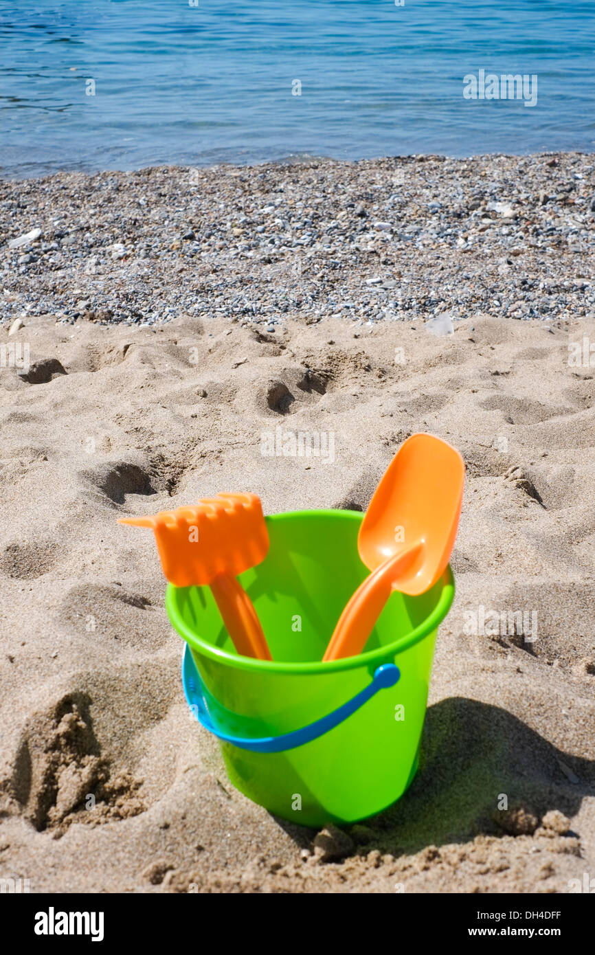 Bucket and shovel on a sandy beach Stock Photo Alamy