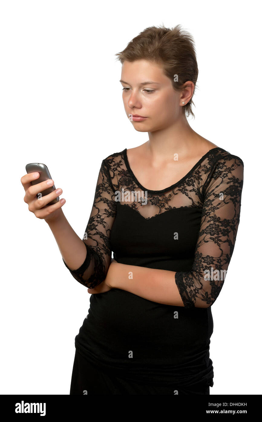 Young woman in evening gown with cellphone, isolated on white background Stock Photo