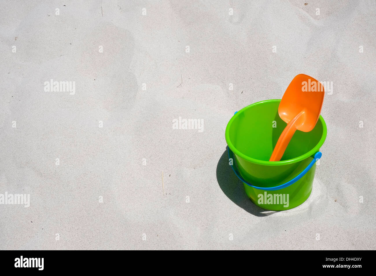 Bucket and shovel on a sandy beach Stock Photo