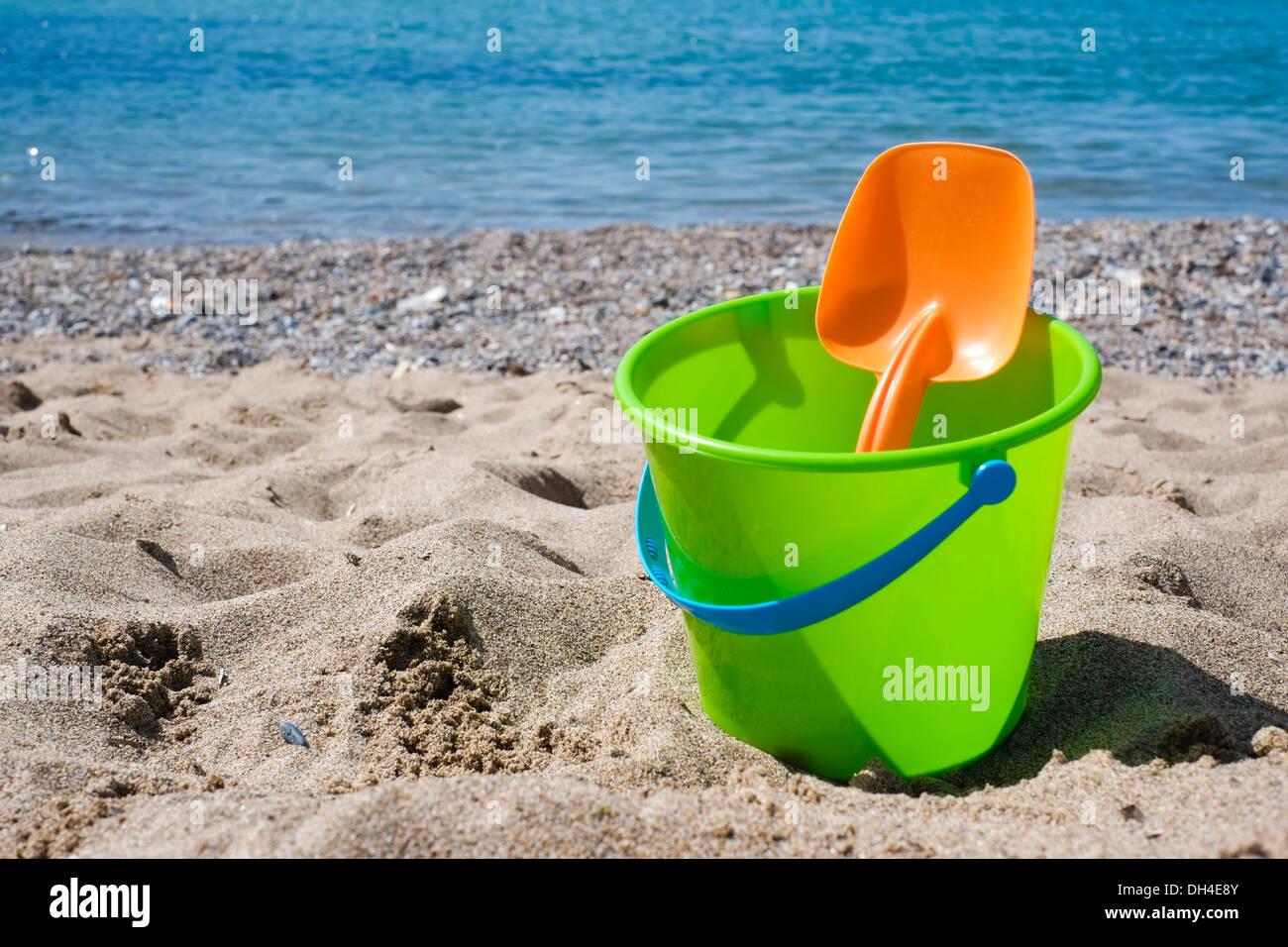 Bucket and shovel on a sandy beach Stock Photo Alamy