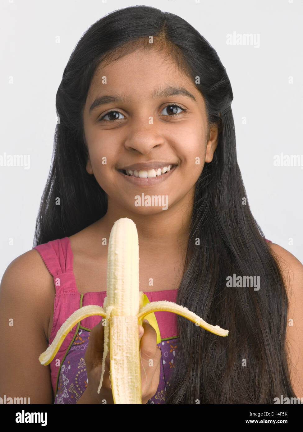 girl eating banana 