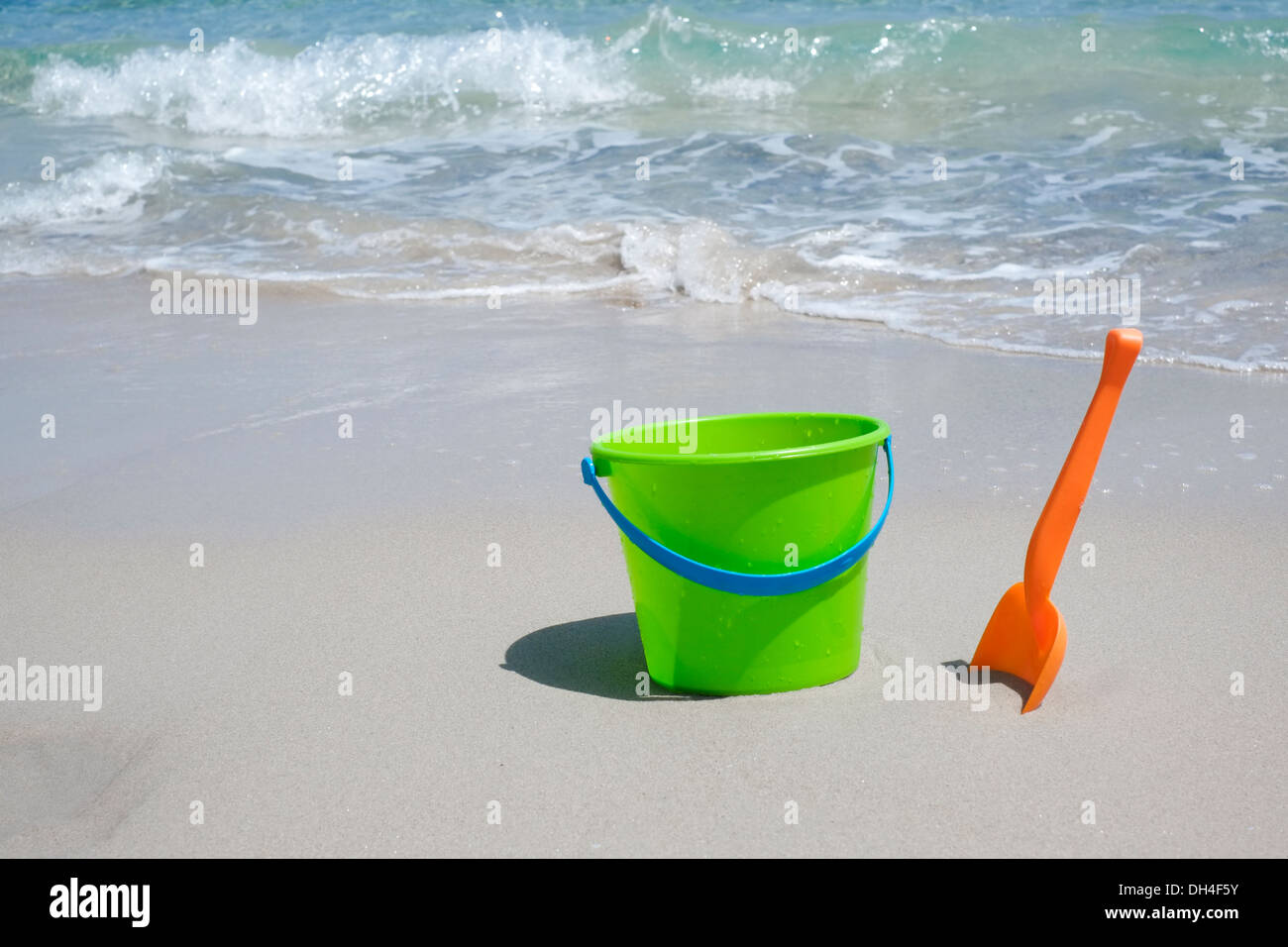 Bucket and shovel on a sandy beach Stock Photo Alamy