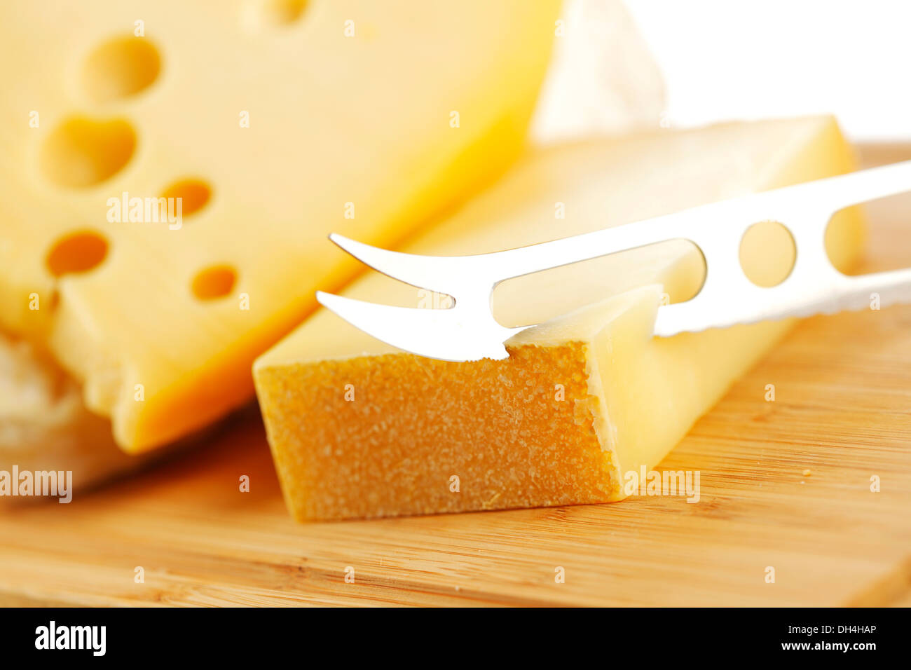 cheese with a cheese knife Stock Photo Alamy