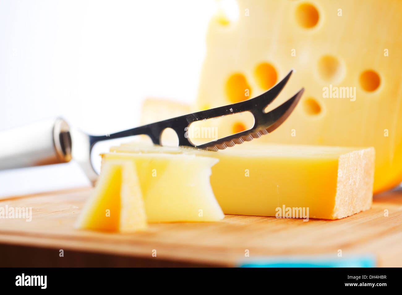 cheese with a cheese knife Stock Photo Alamy