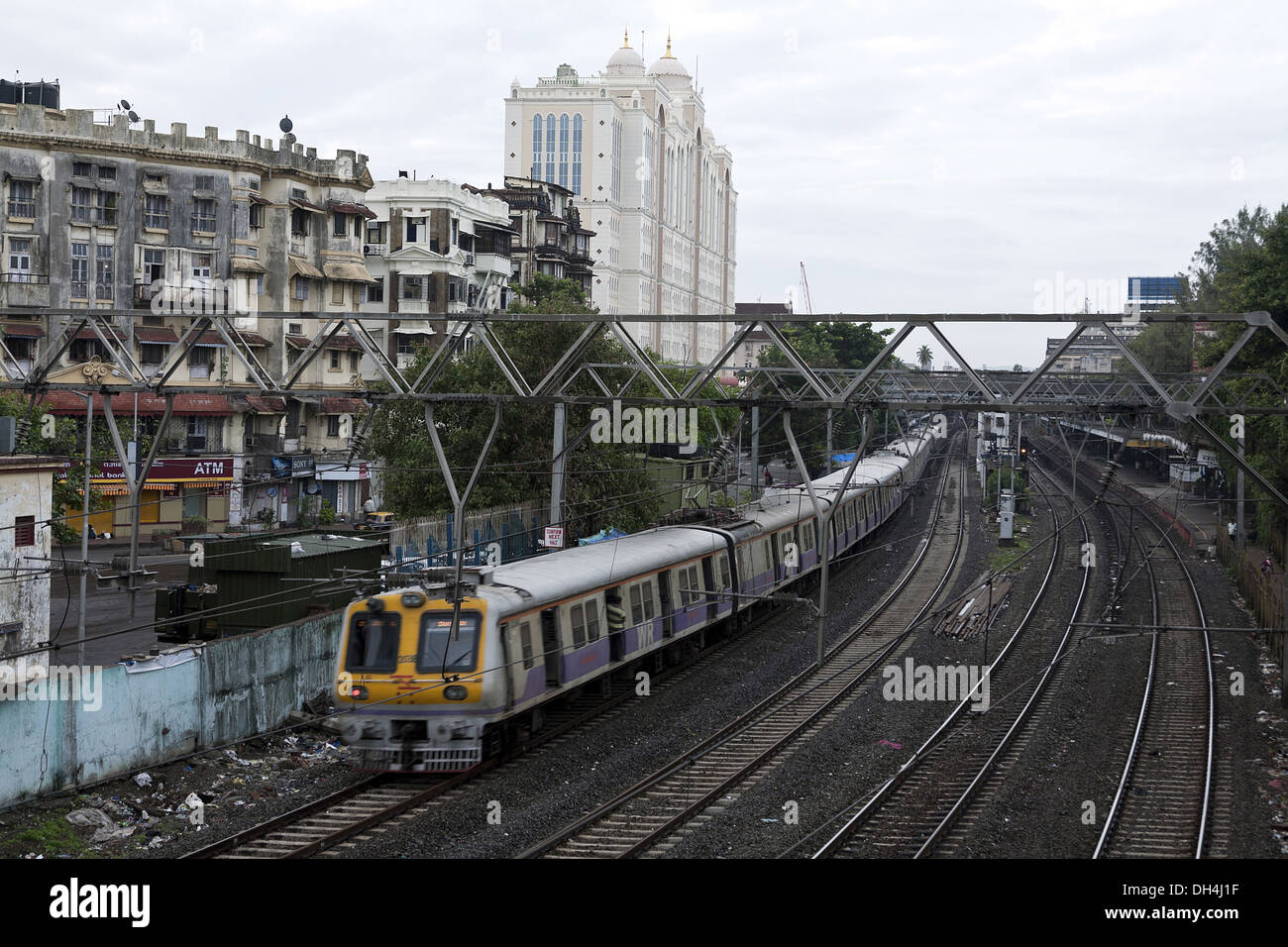 Western Railway Local Train running on Tracks Charni Road Mumbai Maharashtra India Asia July 2012 Stock Photo
