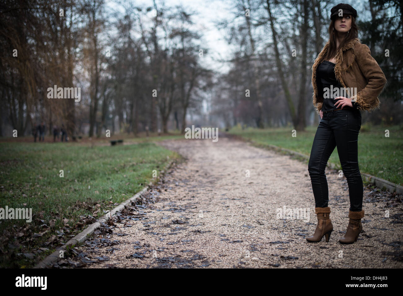 young woman in jacket standing and posing at the forest Stock Photo - Alamy