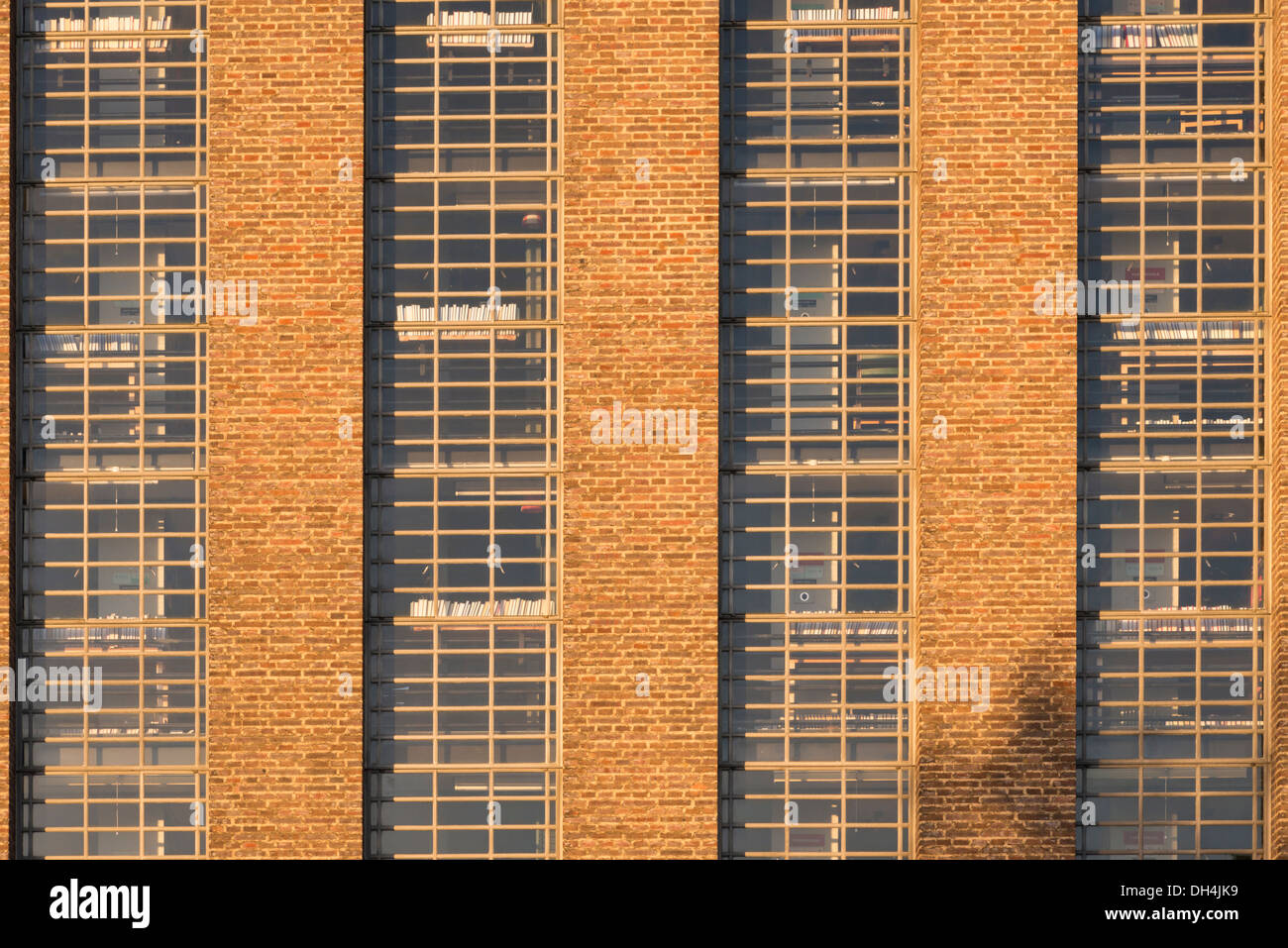 The Cambridge University Library  building showing the windows and glass pattern in early morning light. Stock Photo