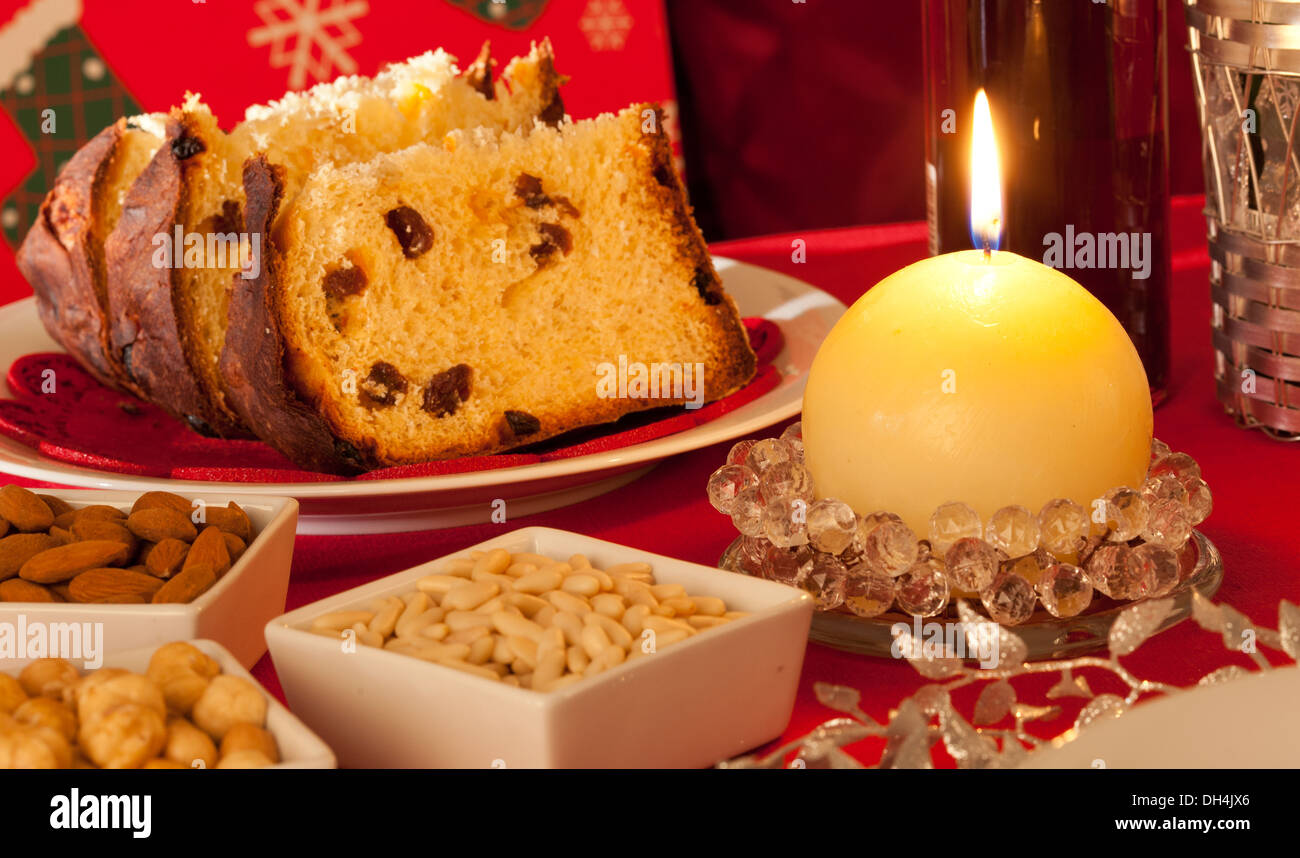 Decorated Christmas Dinner Table Setting with food and candeles Stock Photo