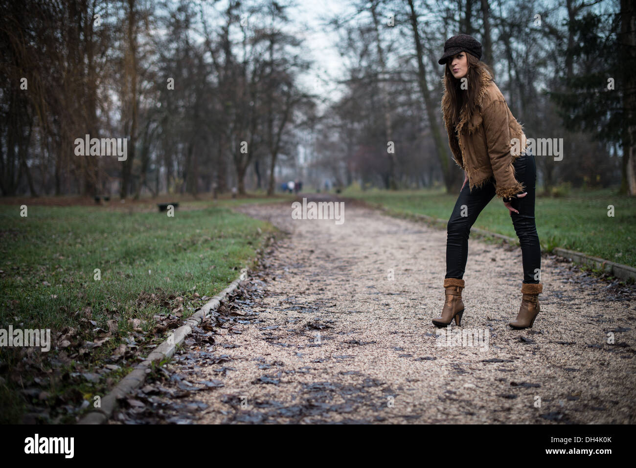 young woman in jacket standing and posing at the forest Stock Photo - Alamy