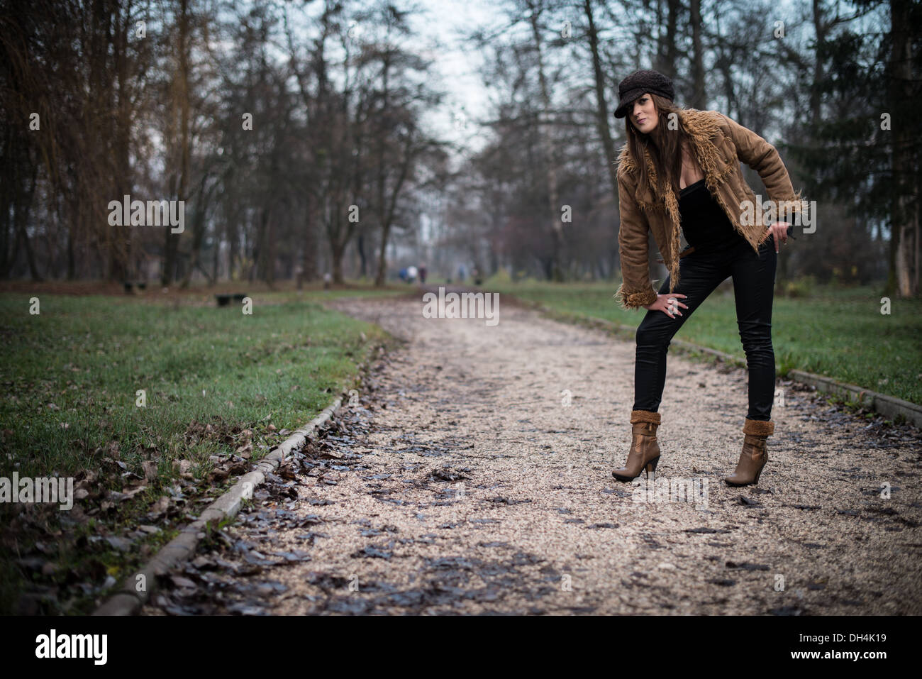 young woman in jacket standing and posing at the forest Stock Photo - Alamy