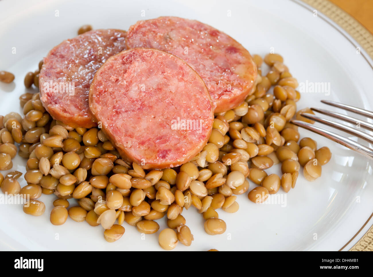 Pig trotter with lentils, traditional italian food Stock Photo Alamy