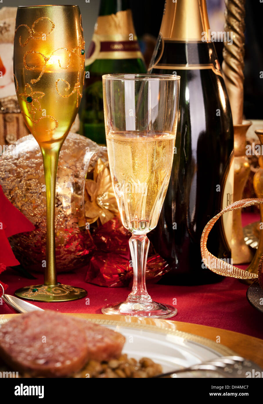 A Glass of Champagne on a decorated Christmas day dinner table. Stock Photo