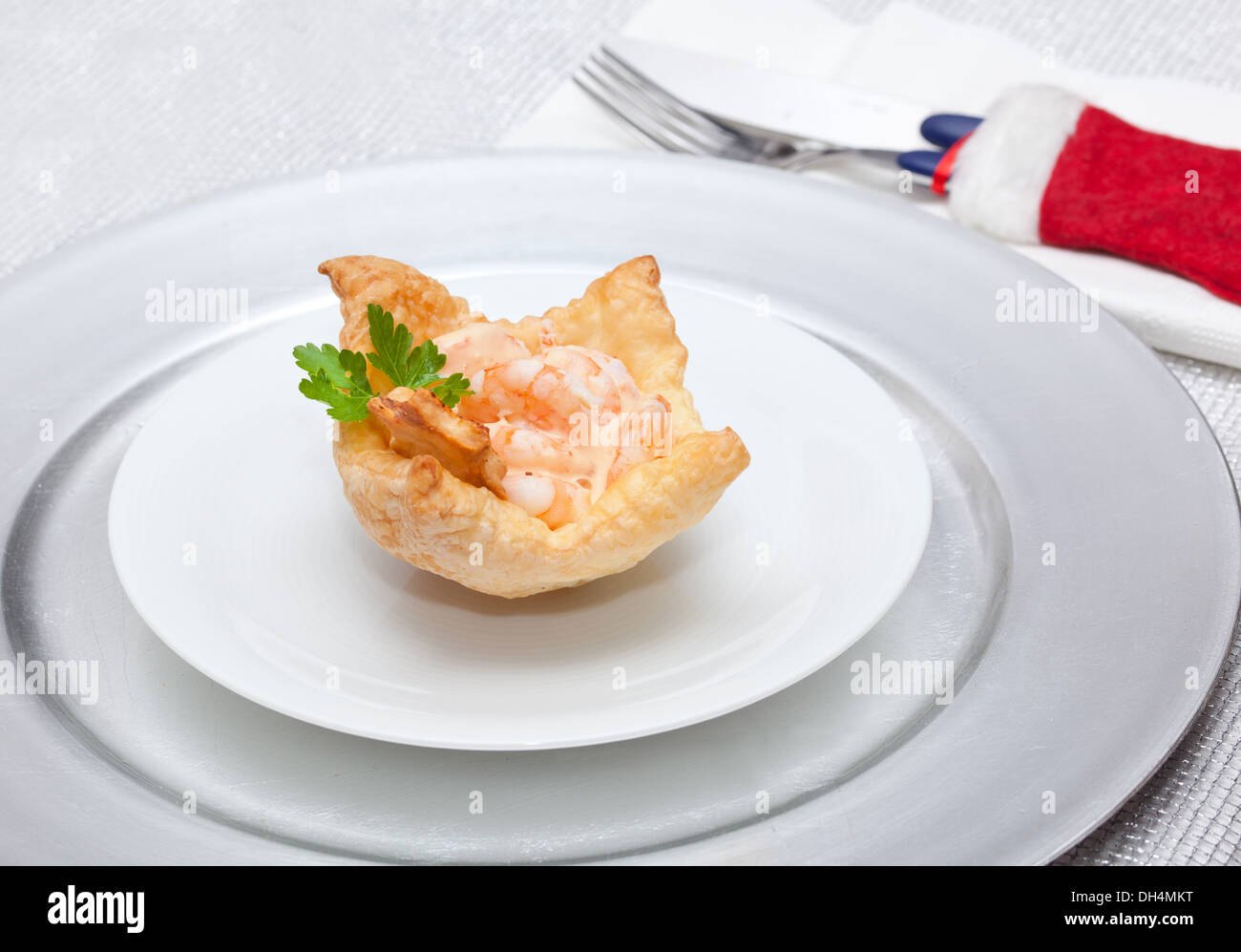 Shrimp cocktail in the puff pastry on christmas table. Stock Photo