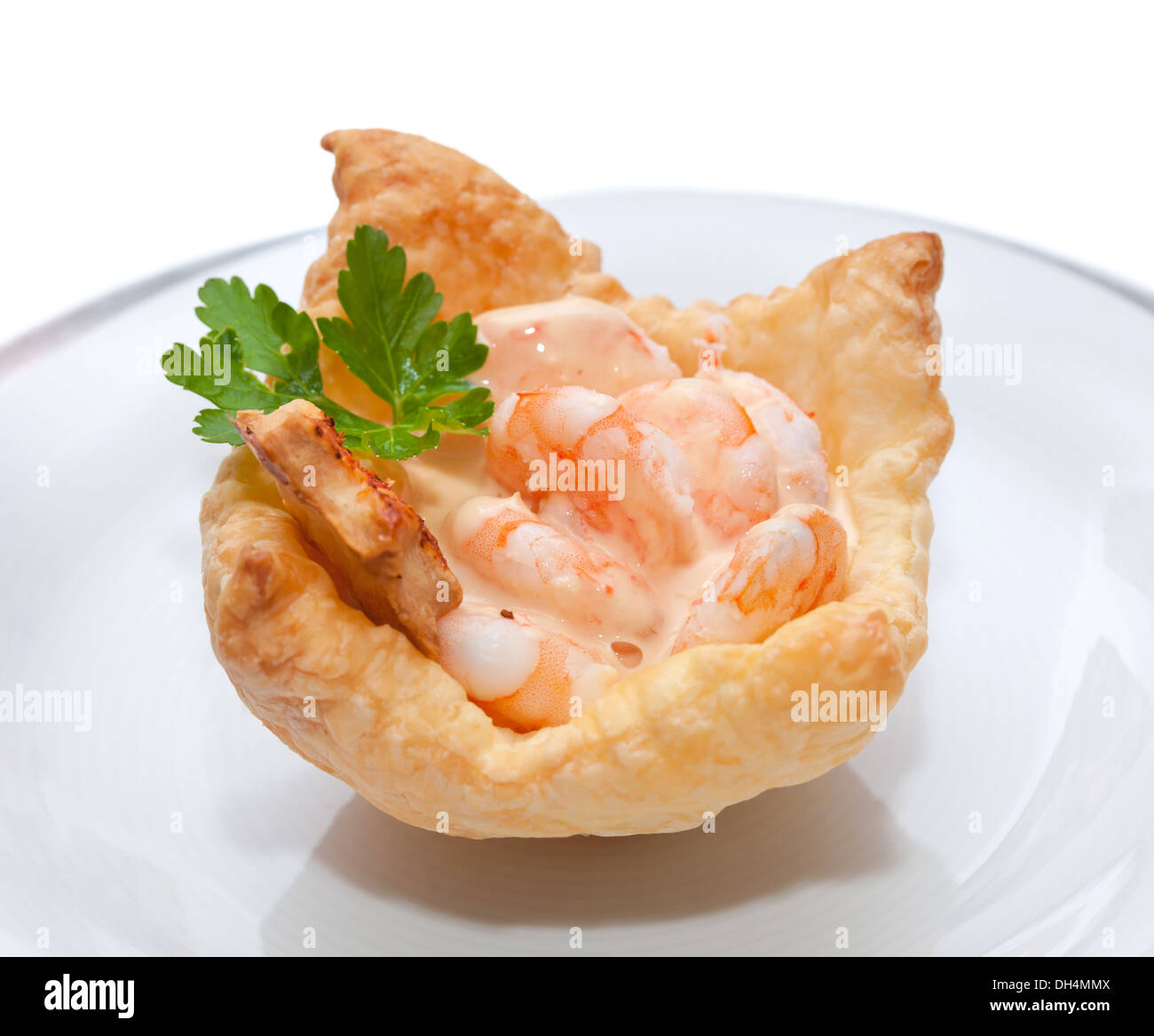 Shrimp cocktail in the puff pastry on christmas table. Stock Photo