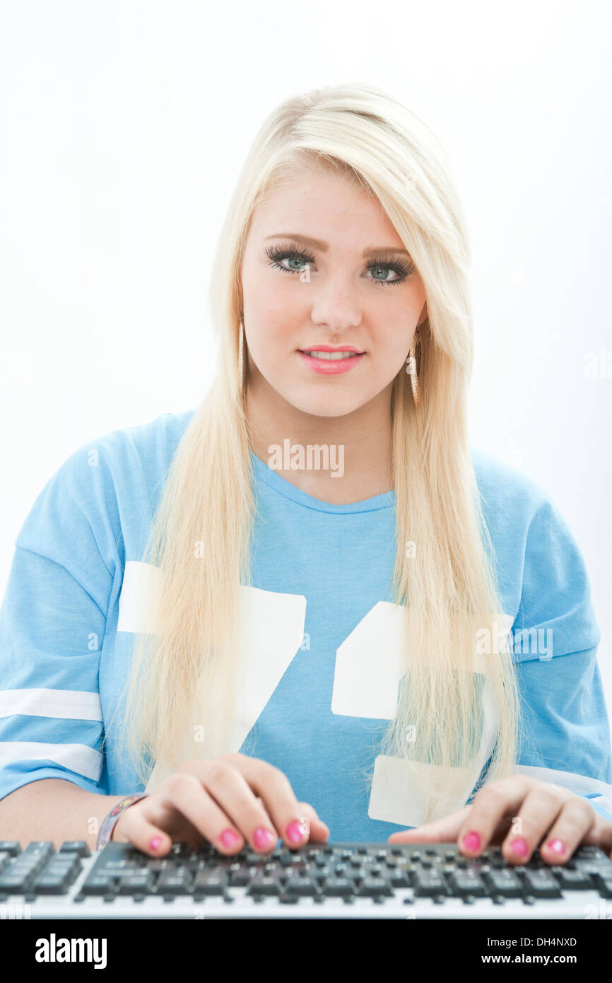Teenage girl viewed from the position of a computer screen. Stock Photo