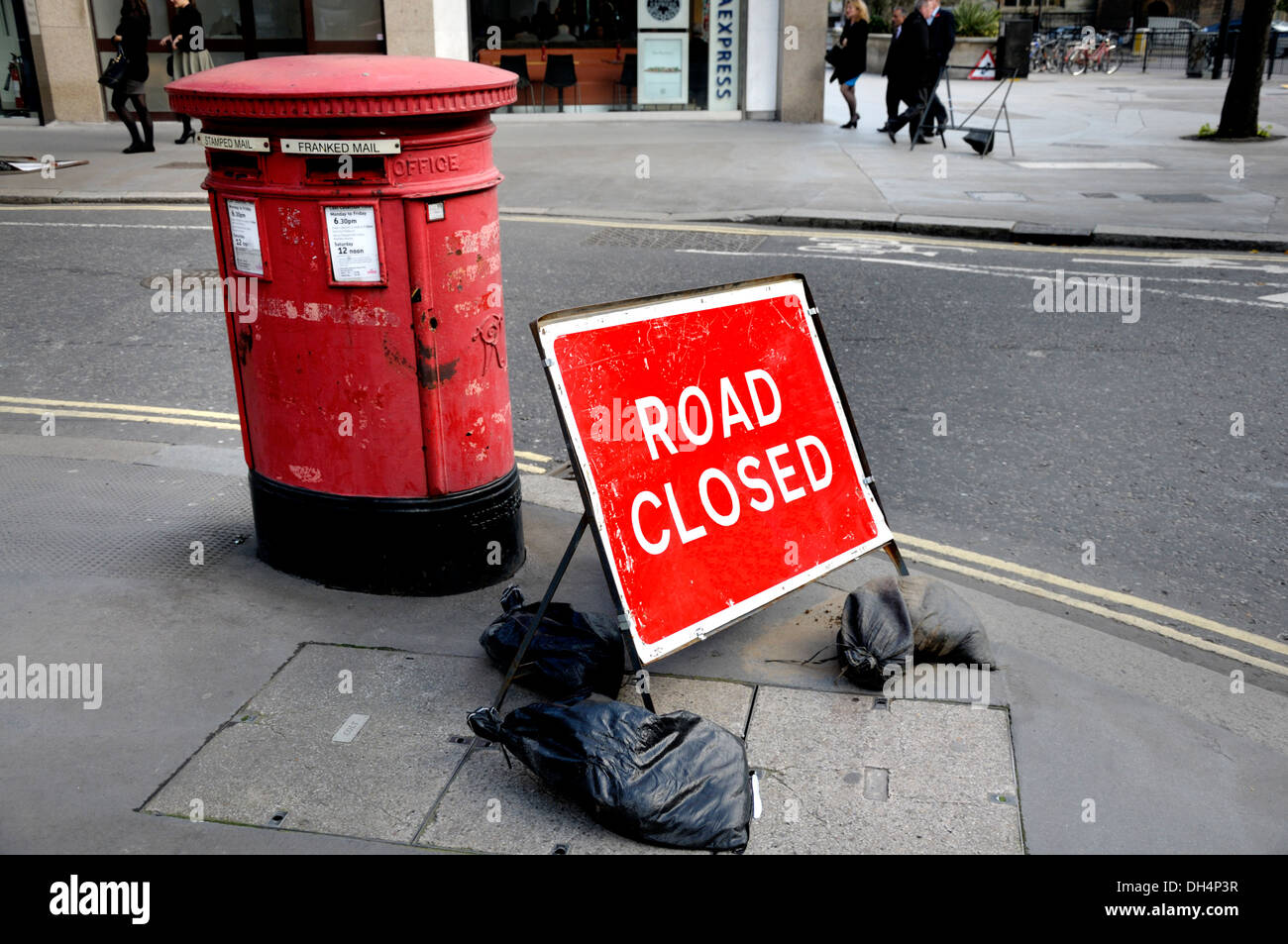 London, England, UK. Red letter box and Road Closed sign in the City Stock Photo