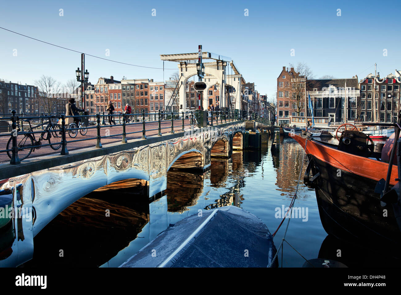 Holland, reflecting artwork 'Amsterdam Light Festival' from Titia Ex called Appears at Amsterdam, on drawbridge Skinny Bridge Stock Photo