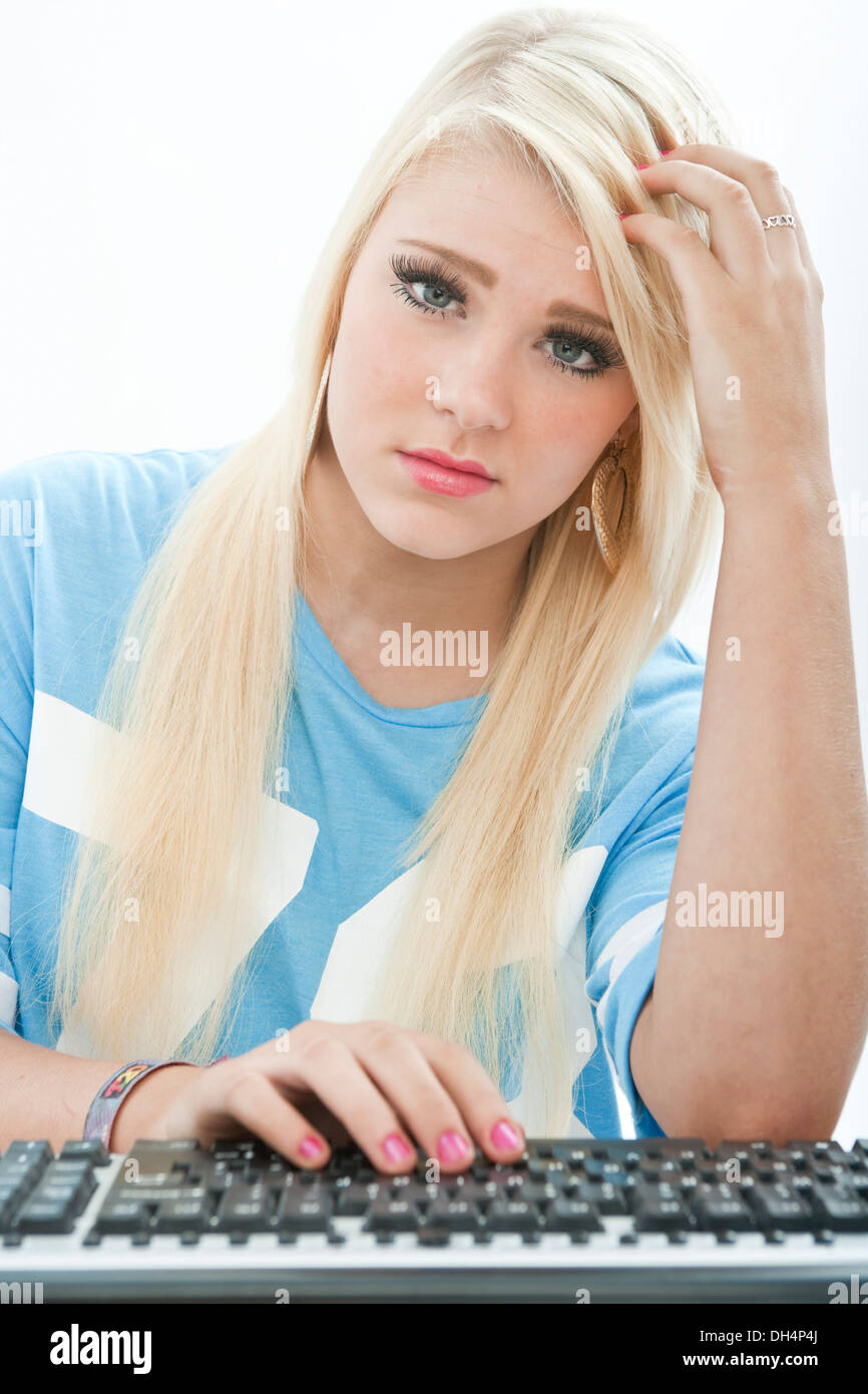 Teenage girl viewed from the position of a computer screen. Stock Photo