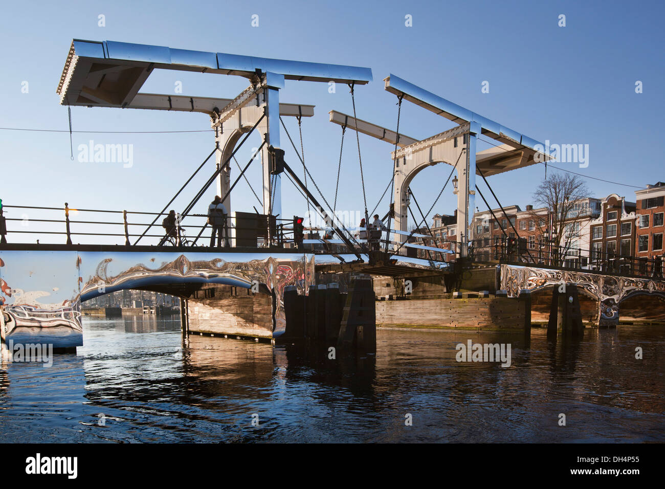 Holland, reflecting artwork 'Amsterdam Light Festival' from Titia Ex called Appears at Amsterdam, on drawbridge Skinny Bridge Stock Photo
