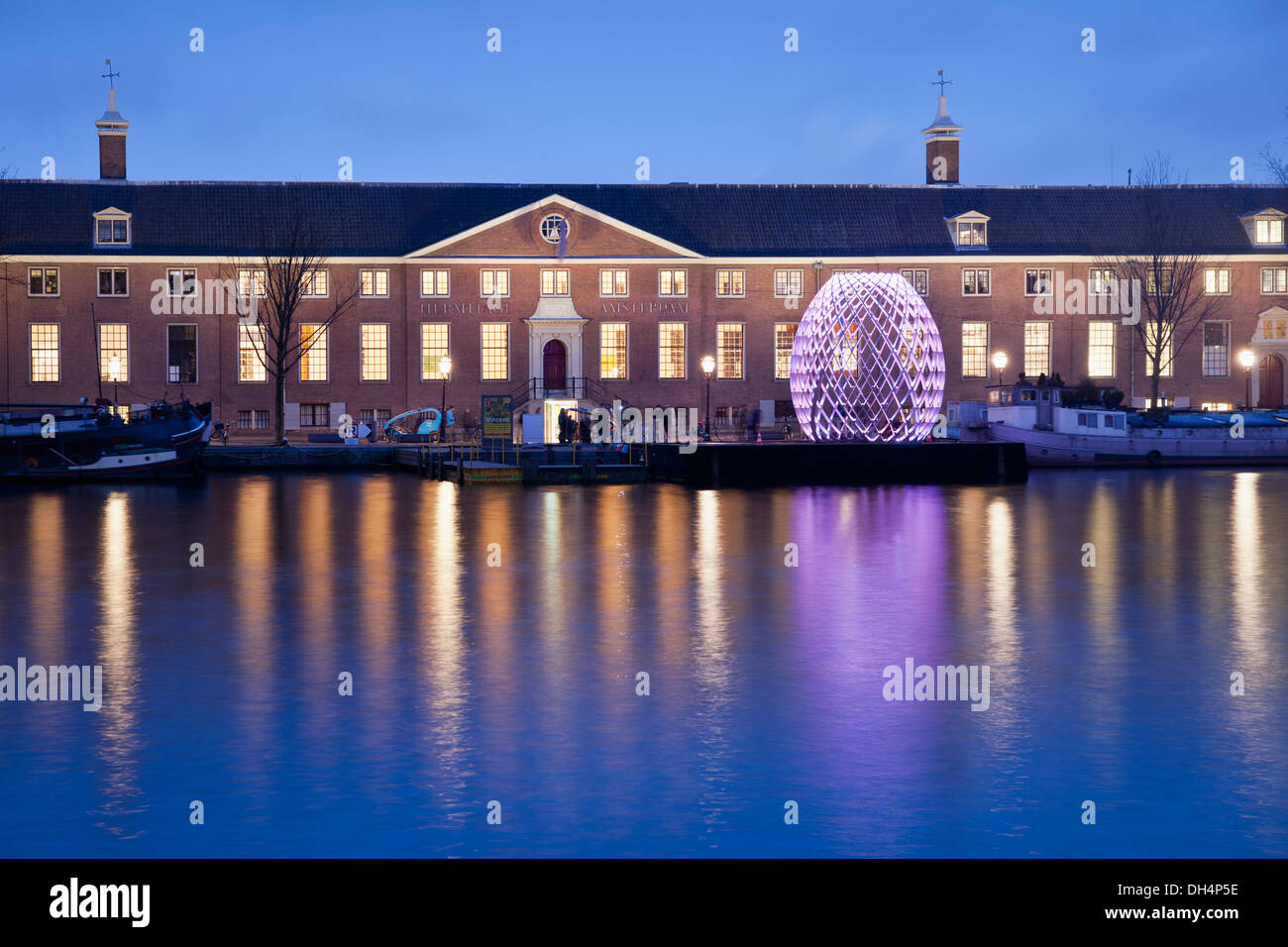 Netherlands, Amsterdam, The Hermitage Amsterdam museum along river Amstel. Twilight Stock Photo