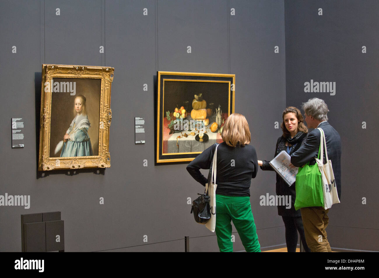 Netherlands, Amsterdam, Rijksmuseum . Guide explaining to visitors in Gallery of Honor Stock Photo