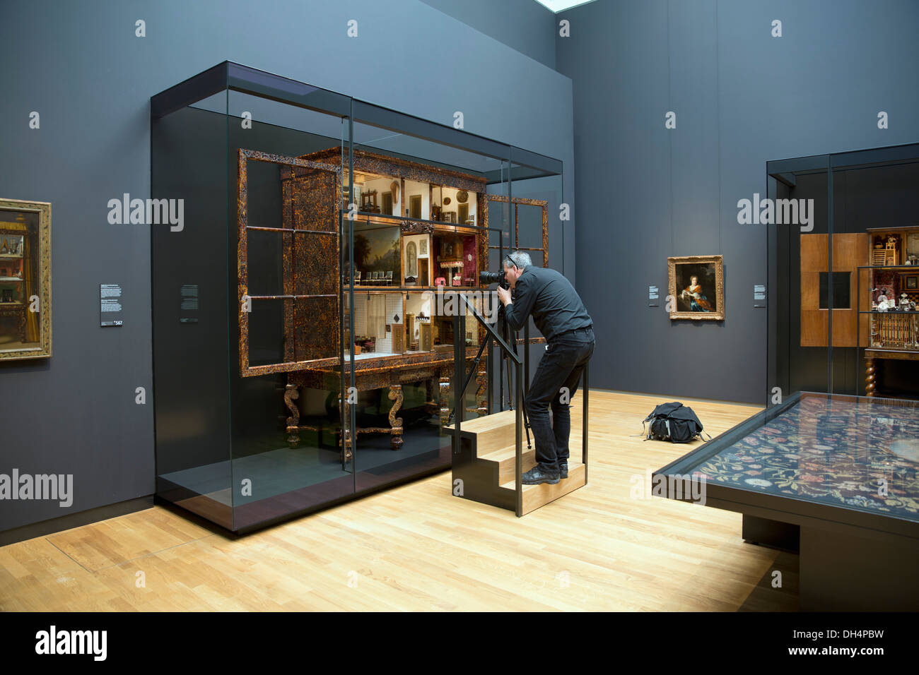 Netherlands, Amsterdam, Rijksmuseum. Photographer taking images of Petronella Oortman dolls house. Artist unknown Stock Photo