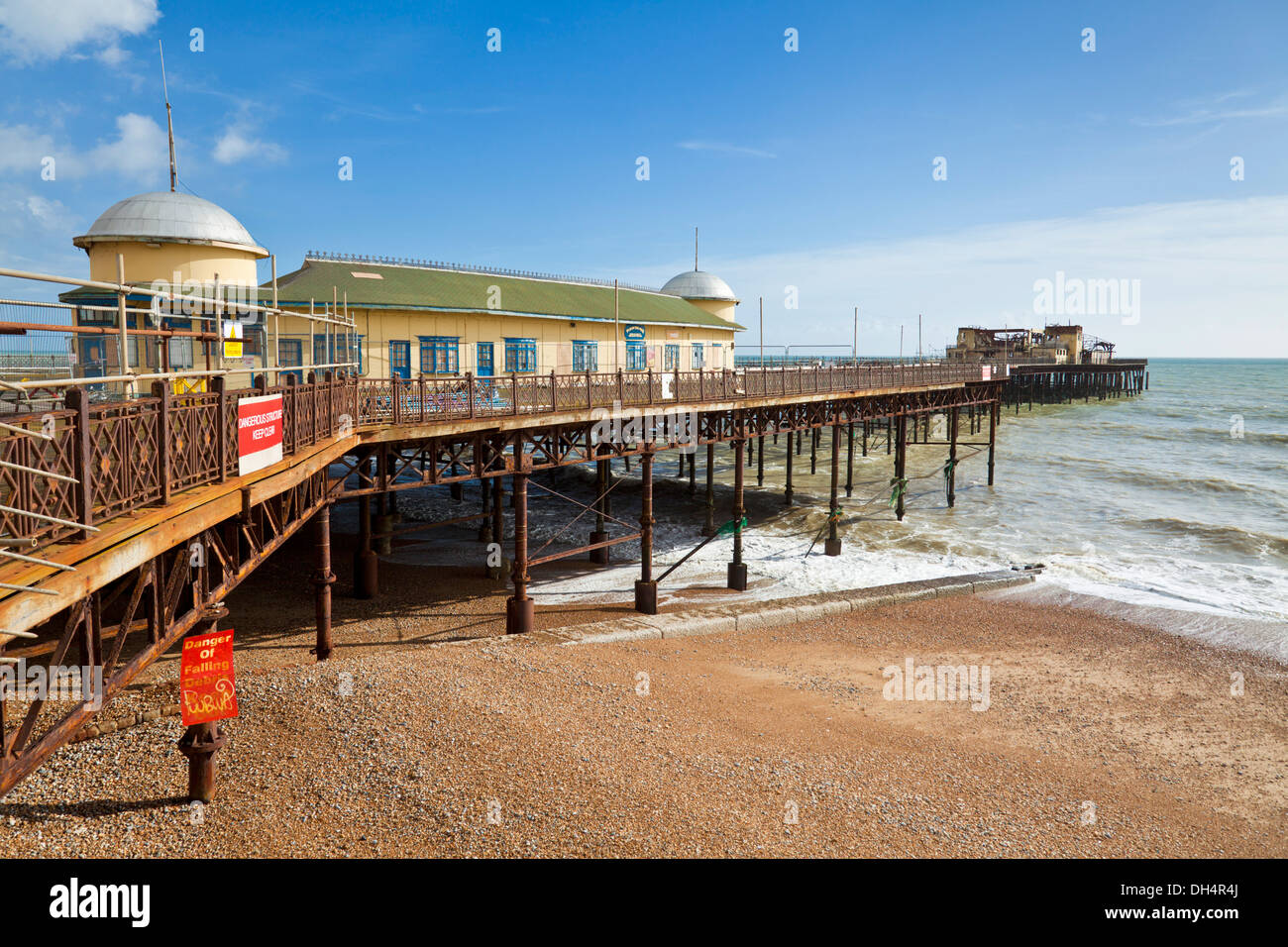 The burnt out ruins of Hastings Pier and Hastings beach at Hastings East Sussex England GB UK Europe Stock Photo