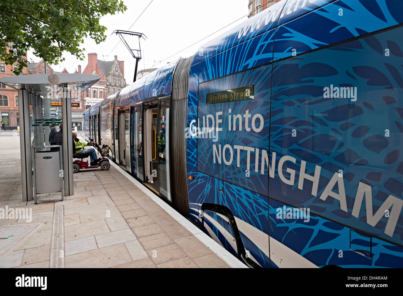 Disabled wheelchair user boarding nottingham hires stock photography