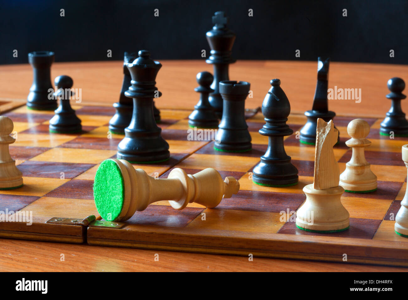 Chess pieces check mate Stock Photo - Alamy