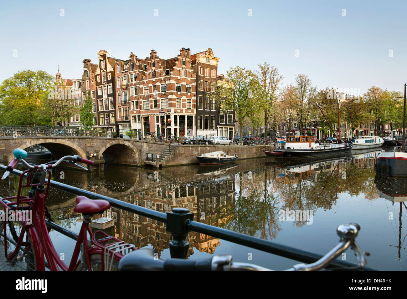 Netherlands, Amsterdam, 17th century houses, houseboats at canal called Brouwersgracht. Bicyles. Unesco World Heritage Site. Stock Photo