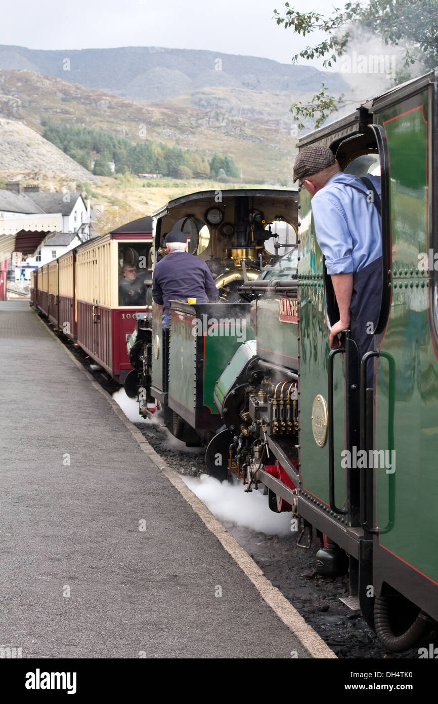 Steam locomotive pulling a passenger train at Blaenau Ffestiniog railway station, Wales Stock Photo