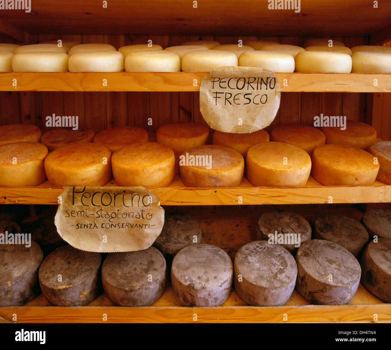 Three types of local Pecorino cheese on sale. La Bottega del Naturista, Pienza, Tuscany, Italy. Stock Photo