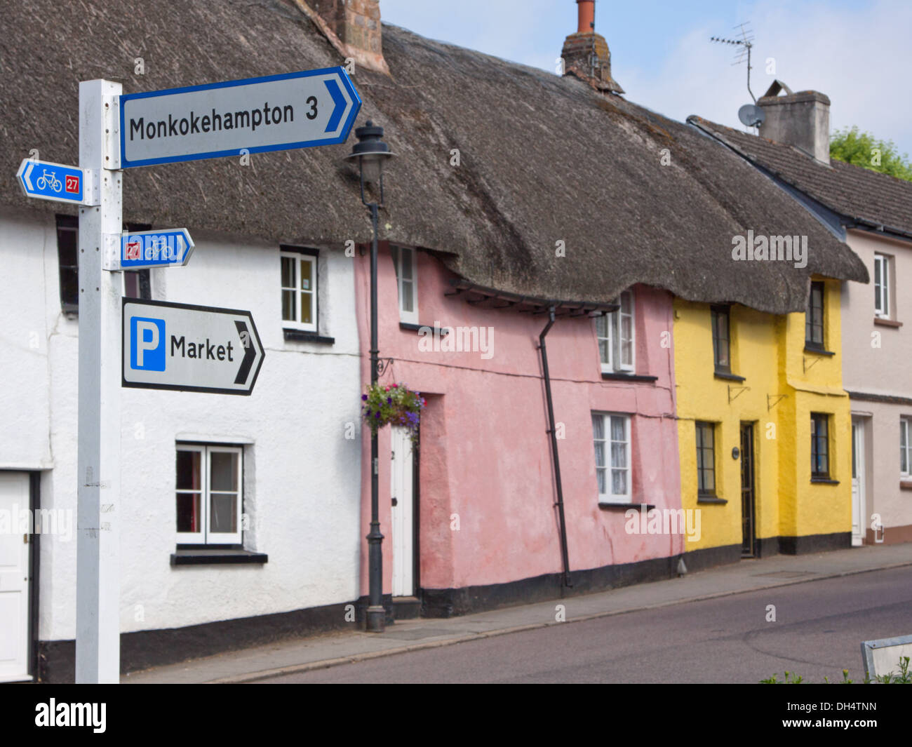 Traditional thatched rooftops on old cottages lining the main road