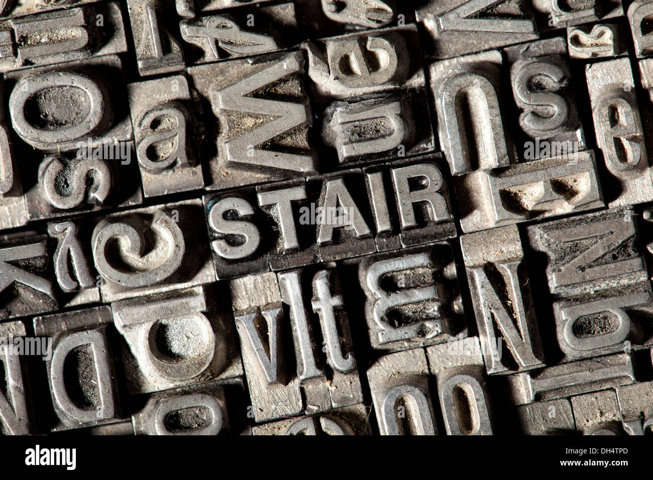 Old lead letters forming the word 'STAIR' Stock Photo