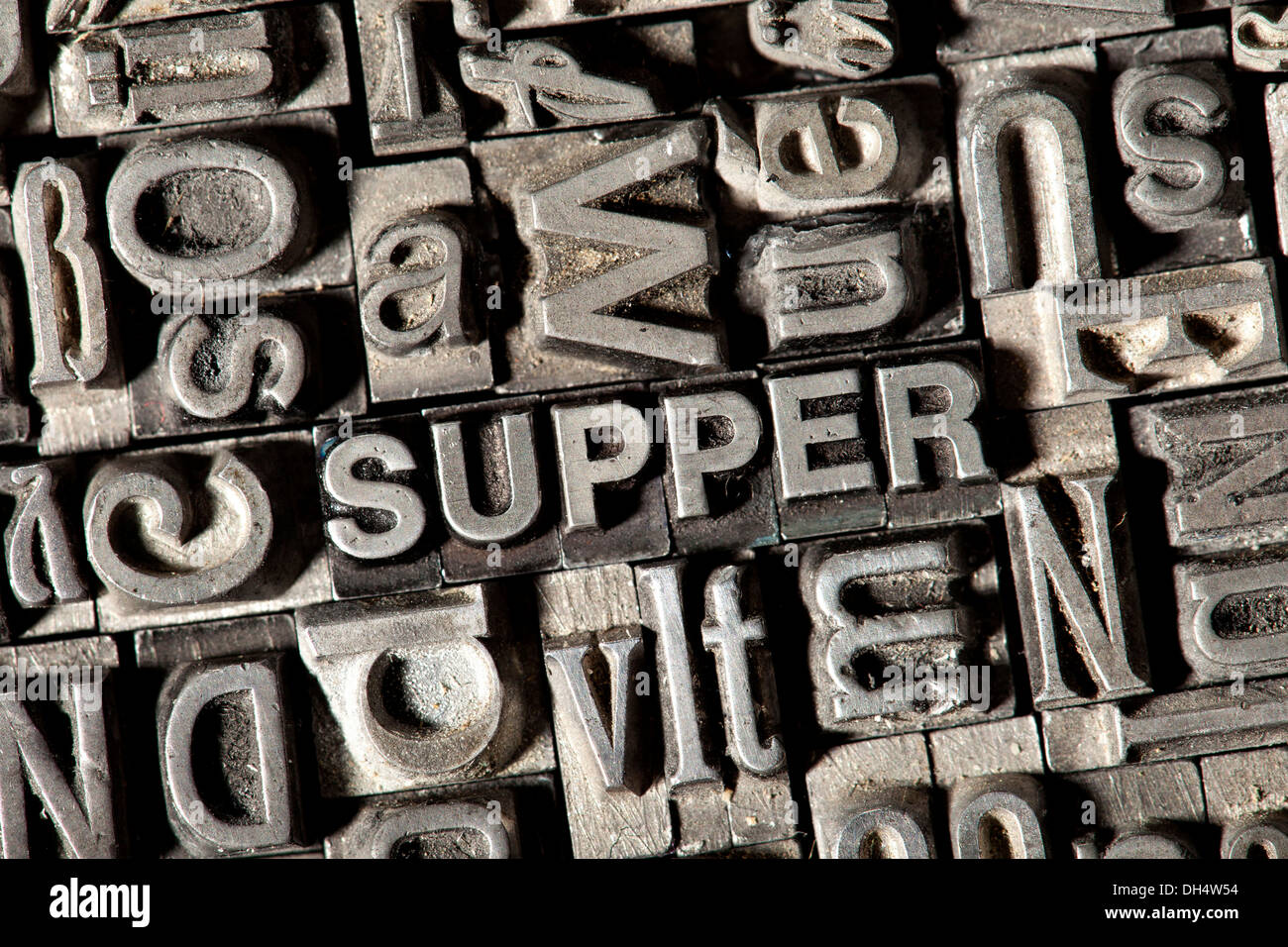 Old lead letters forming the word &quot;SUPPER&quot; Stock Photo