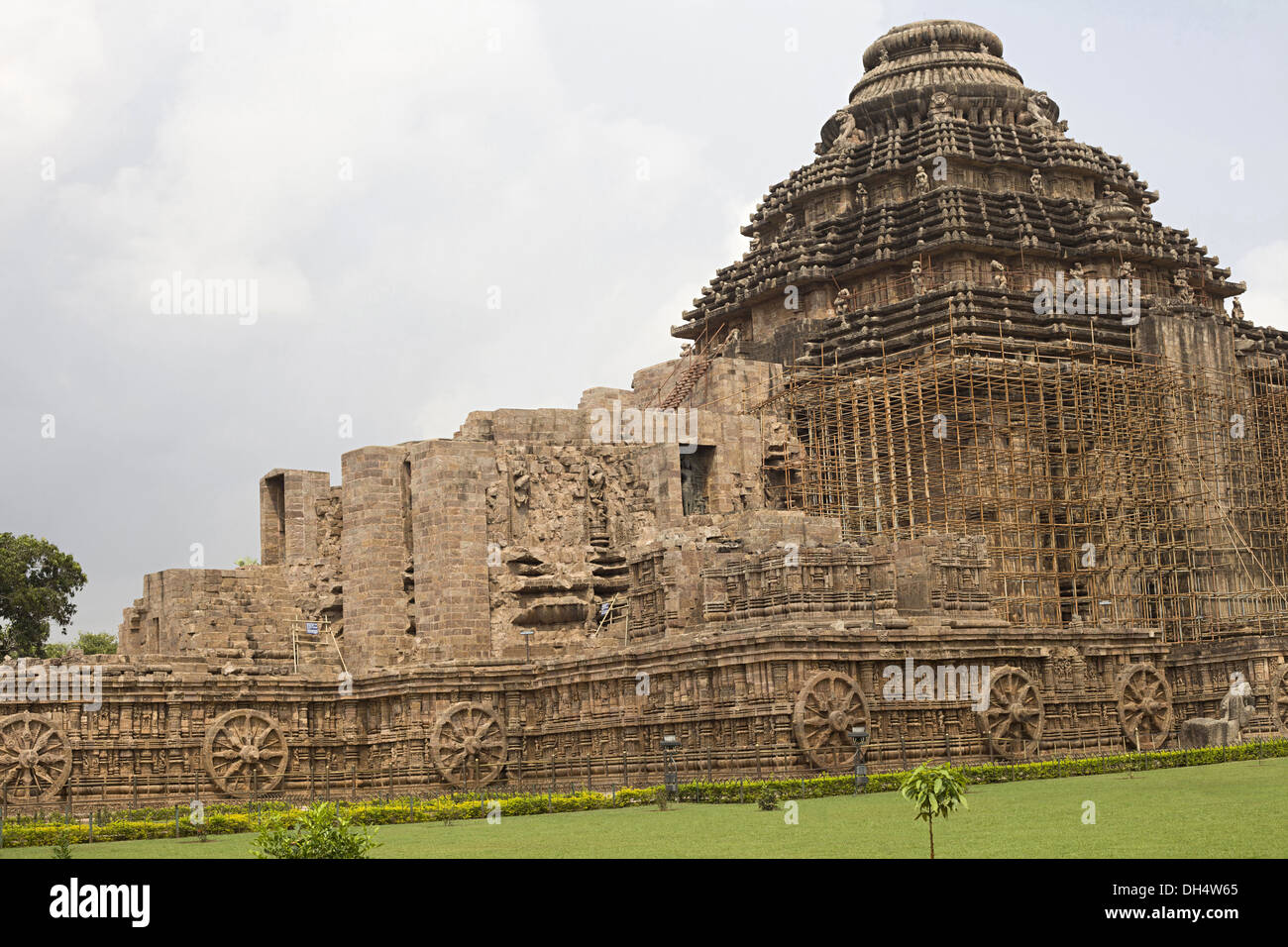 Façade of the Konark Sun temple designed to resemble a chariot with 12 carved giant wheels pulled by a team of 7 horses, UNESCO heritage Site Stock Photo