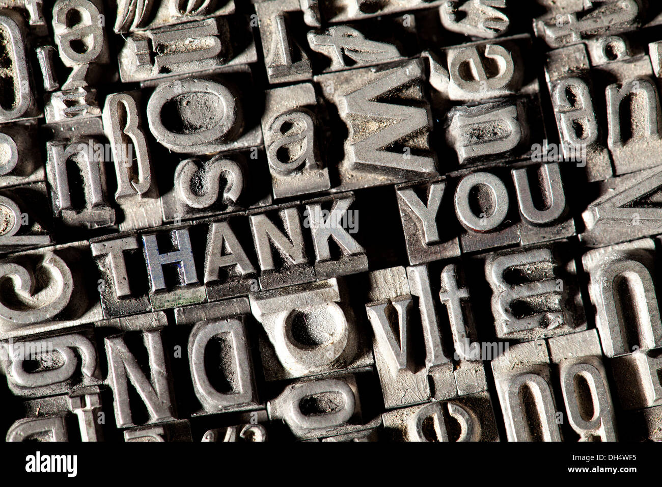 Old lead letters forming the phrase THANK YOU Stock Photo