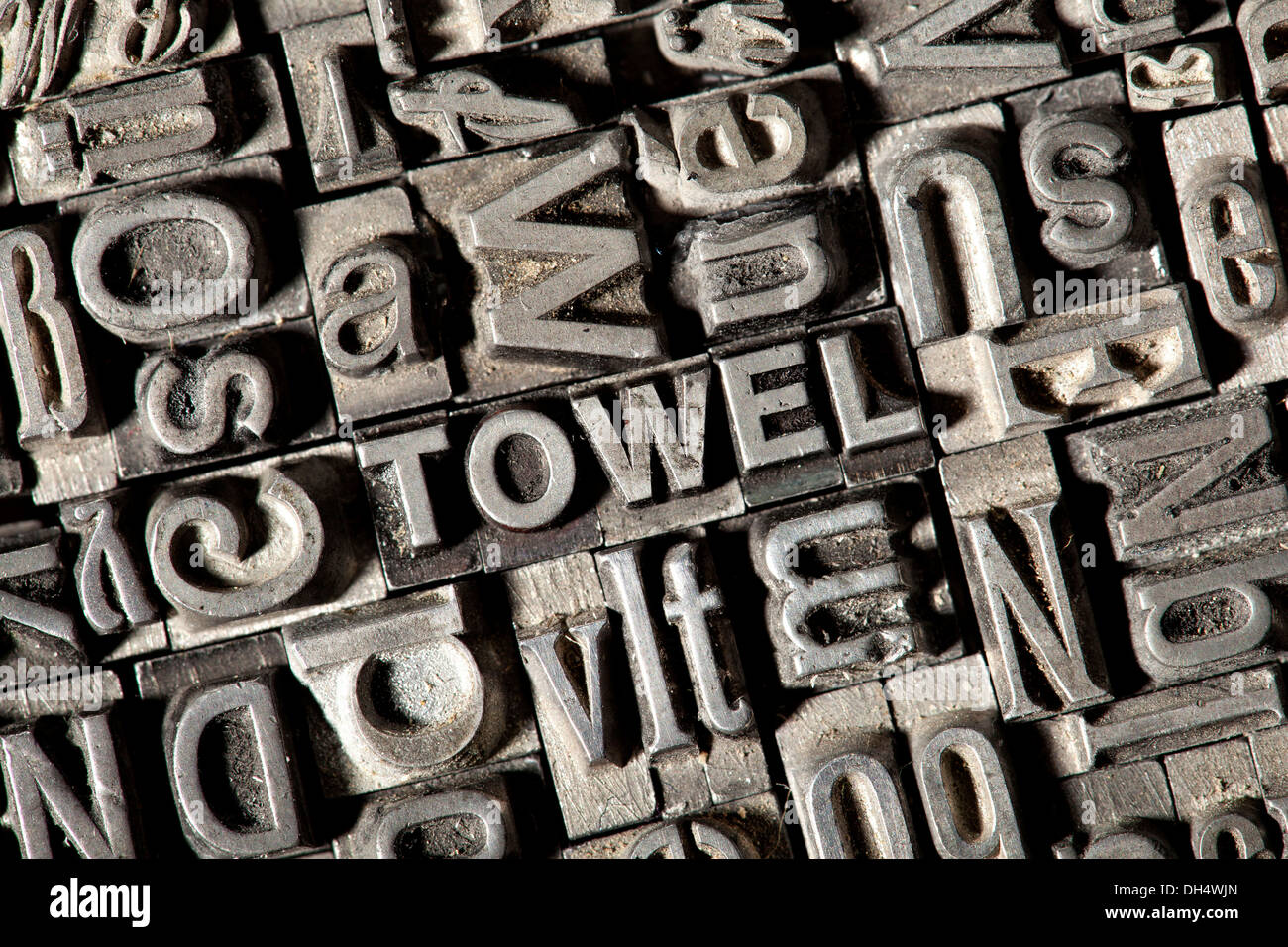 Old lead letters forming the word TOWEL Stock Photo