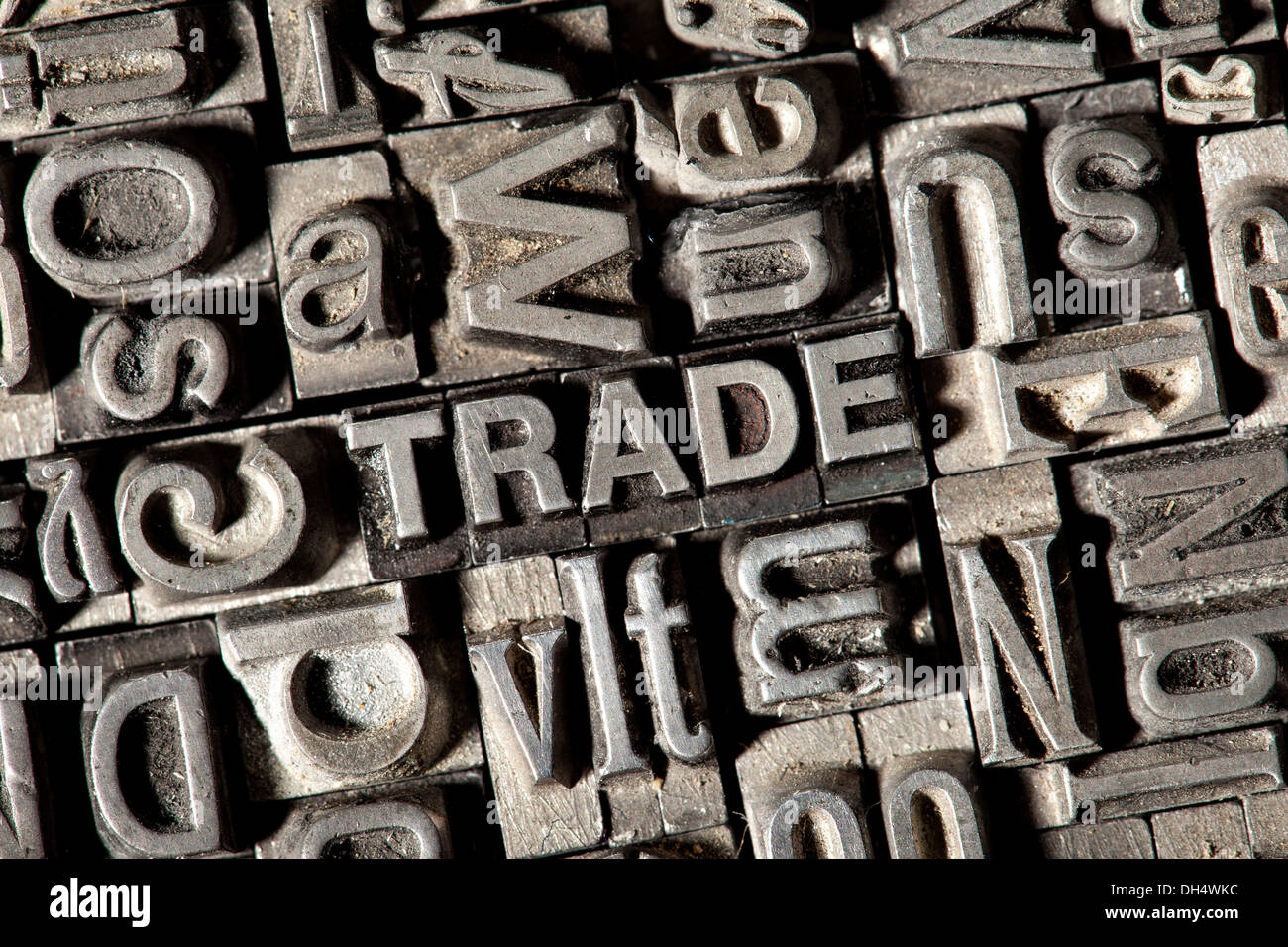 Old lead letters forming the word TRADE Stock Photo