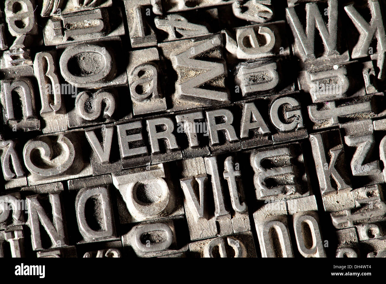 Old lead letters forming the word VERTRAG, German for contract Stock Photo