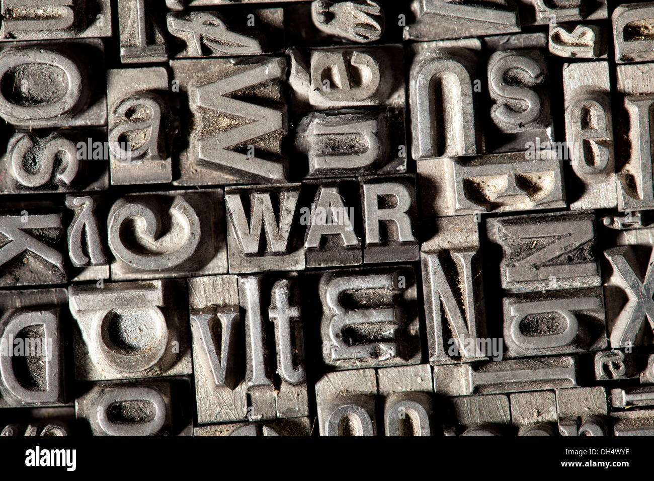 Old lead letters forming the word WAR Stock Photo