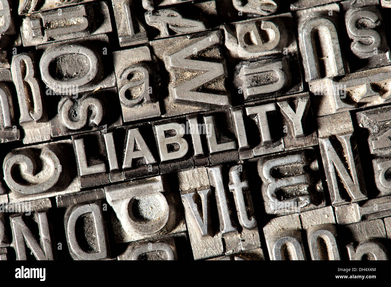 Old lead letters forming the word LIABILITY Stock Photo
