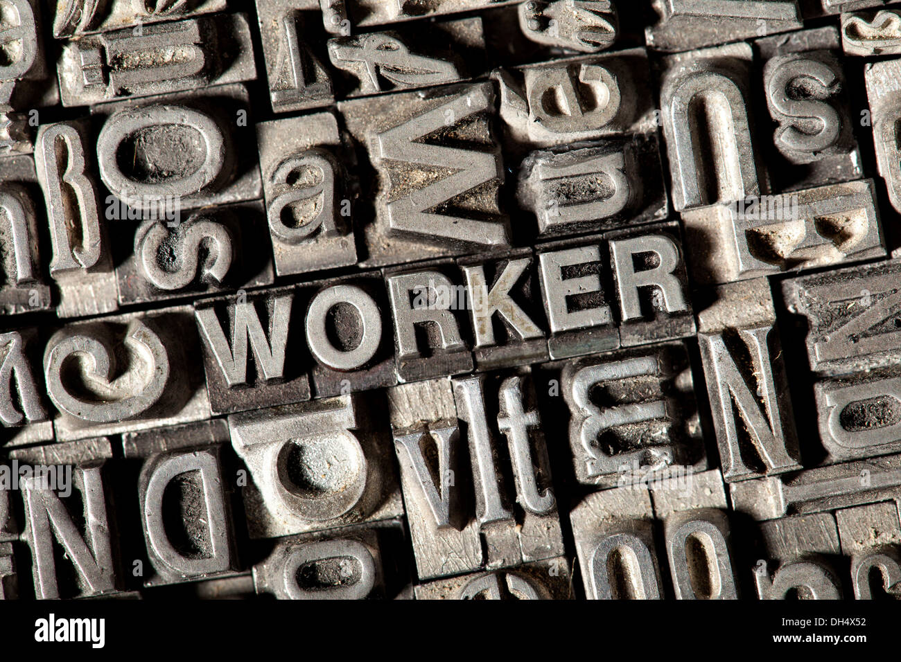 Old lead letters forming the word WORKER Stock Photo